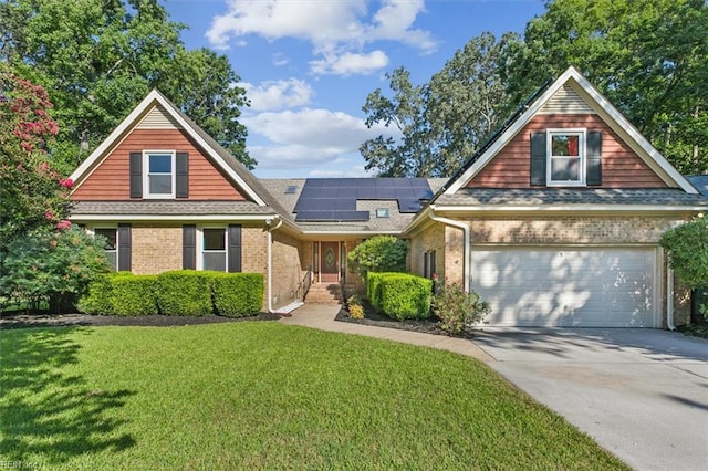 view of property with solar panels, a garage, and a front lawn