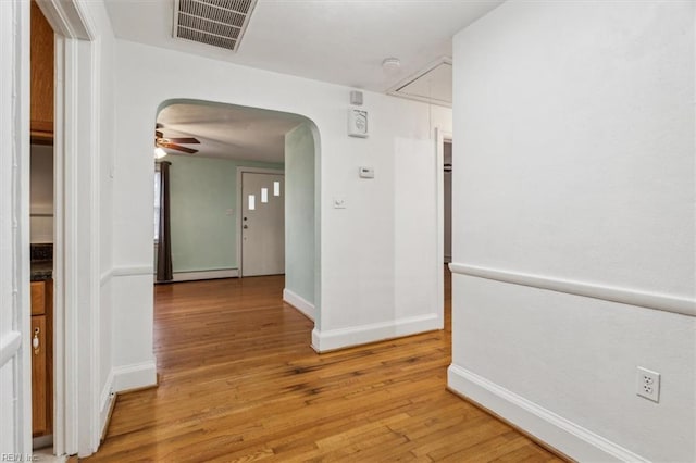 hall with light wood-type flooring