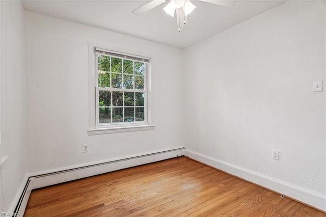 empty room featuring ceiling fan, light hardwood / wood-style flooring, and a baseboard radiator