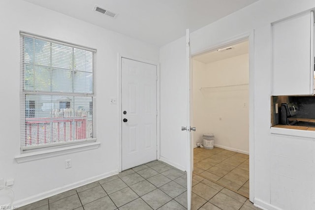 view of tiled foyer entrance