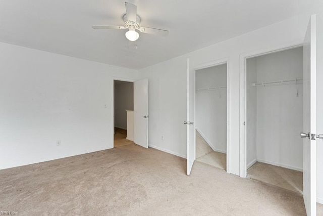 unfurnished bedroom with light colored carpet and ceiling fan