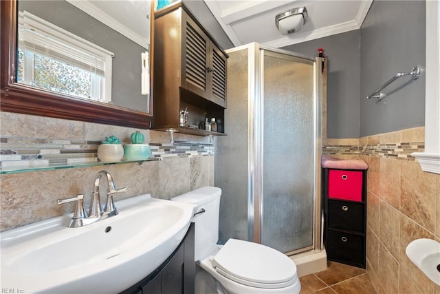 bathroom with a shower with door, sink, tile walls, tile patterned flooring, and toilet