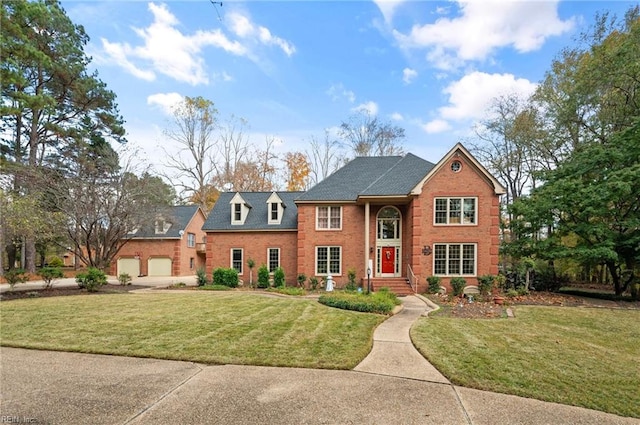 view of front facade featuring a front yard and a garage