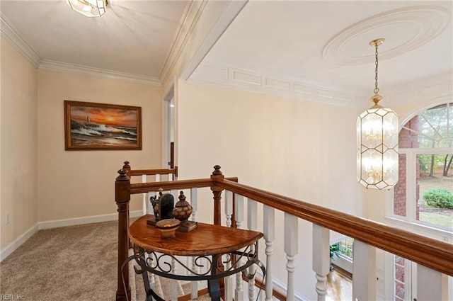 corridor featuring carpet floors, plenty of natural light, and crown molding