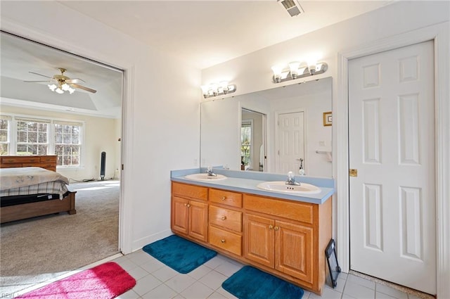 bathroom featuring vanity, tile patterned floors, and ceiling fan