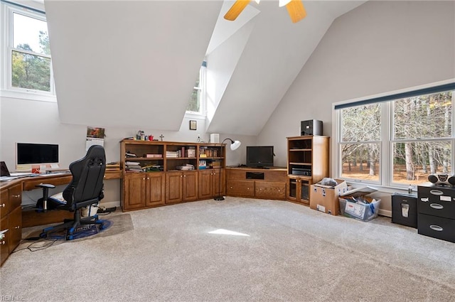 office space with light carpet, ceiling fan, and lofted ceiling