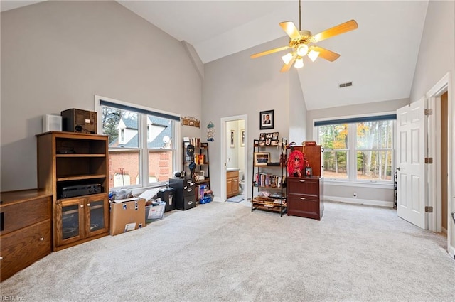 home office with ceiling fan, light carpet, and high vaulted ceiling