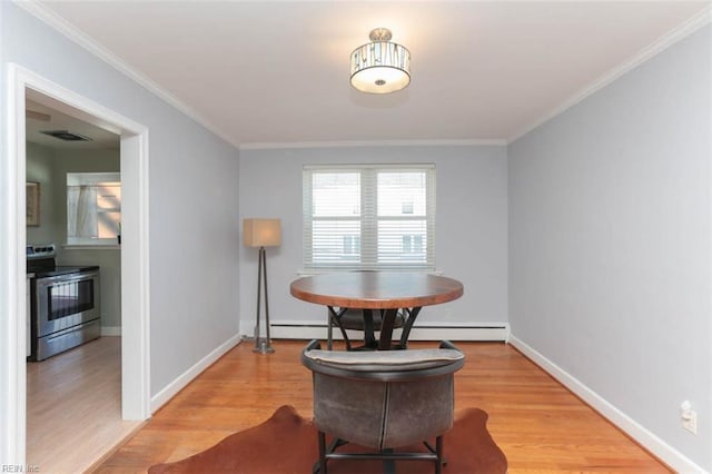 sitting room with wood-type flooring, ornamental molding, and a baseboard radiator