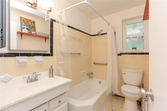 full bathroom with tile patterned floors, toilet, tile walls, and shower / bath combo with shower curtain