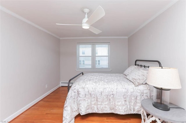 bedroom with hardwood / wood-style floors, ceiling fan, ornamental molding, and baseboard heating