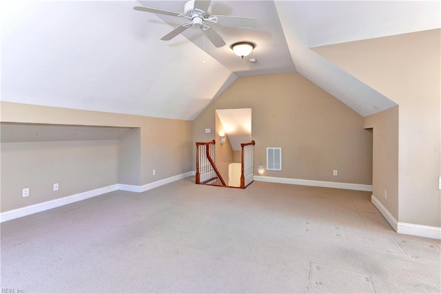 bonus room featuring ceiling fan, lofted ceiling, and light carpet