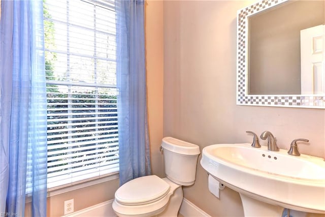 bathroom featuring sink and toilet