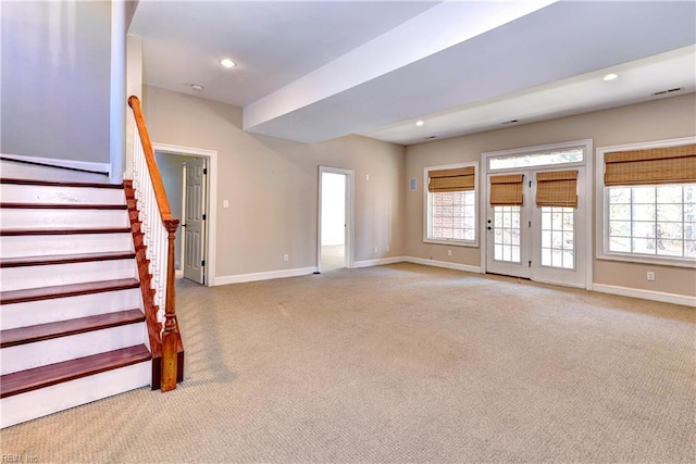 unfurnished living room with light carpet