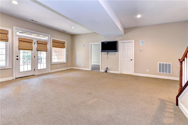 unfurnished living room with carpet floors