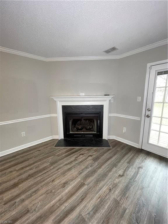 details with ornamental molding, a textured ceiling, and hardwood / wood-style flooring