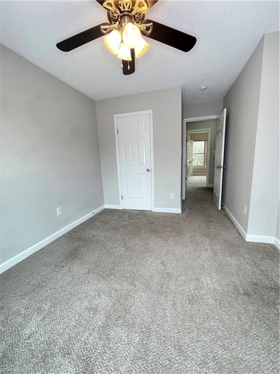 unfurnished bedroom with carpet and ceiling fan