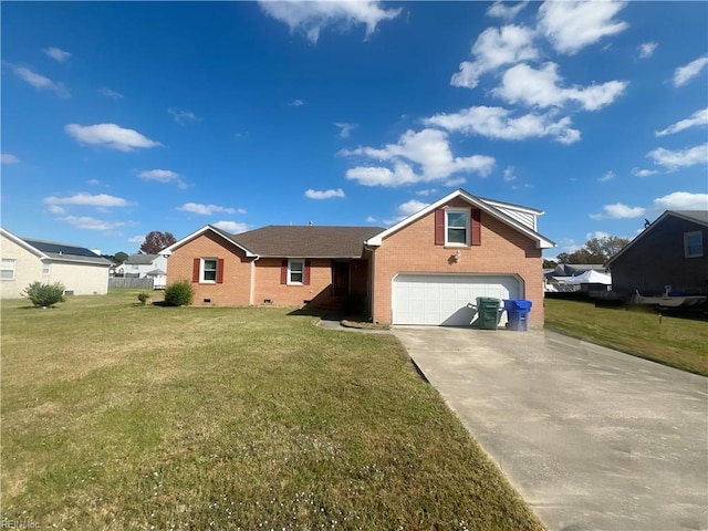 view of front of house featuring a front yard and a garage