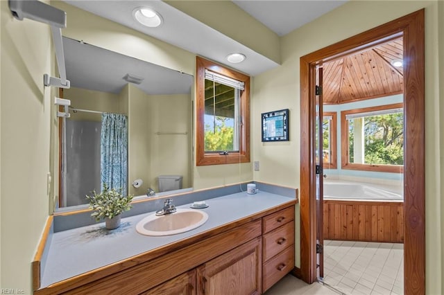 full bathroom with tile patterned flooring, vanity, toilet, and plus walk in shower