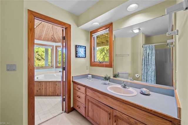 full bathroom featuring tile patterned flooring, vanity, toilet, and plus walk in shower