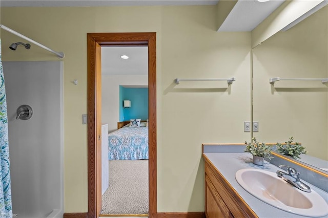 bathroom featuring curtained shower and vanity