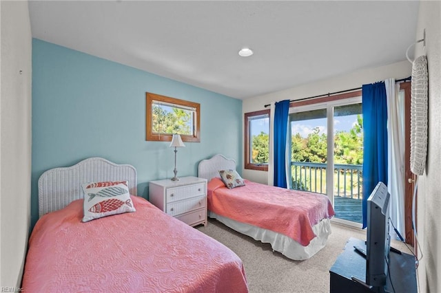 bedroom featuring carpet flooring and access to exterior