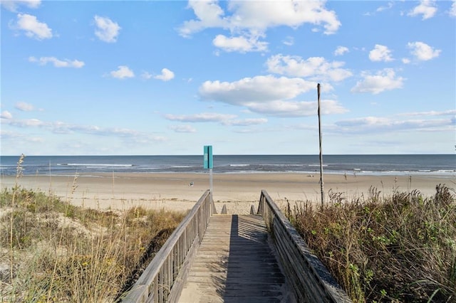 view of water feature with a beach view