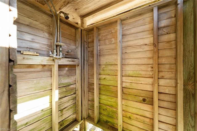 interior space featuring wood walls