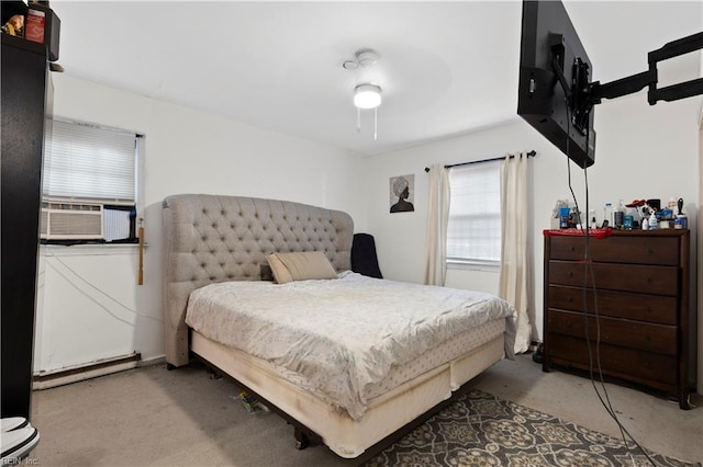 bedroom with ceiling fan and cooling unit