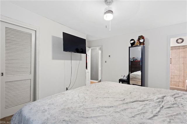 bedroom featuring connected bathroom and ceiling fan