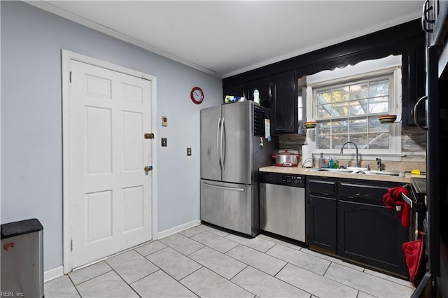 kitchen featuring tasteful backsplash, ornamental molding, stainless steel appliances, sink, and light tile patterned flooring