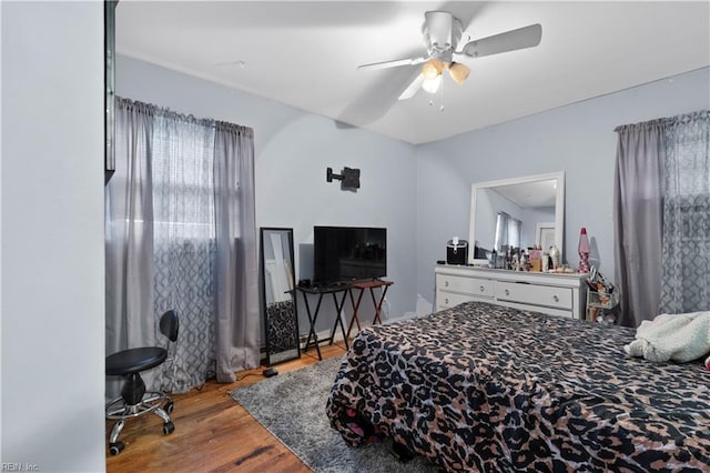 bedroom featuring ceiling fan and light hardwood / wood-style flooring