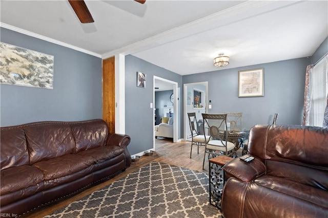 living room with ceiling fan, hardwood / wood-style floors, and ornamental molding