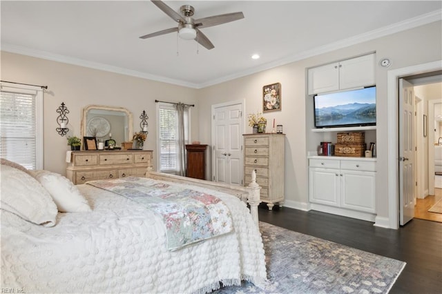 bedroom featuring ceiling fan, dark hardwood / wood-style flooring, and crown molding