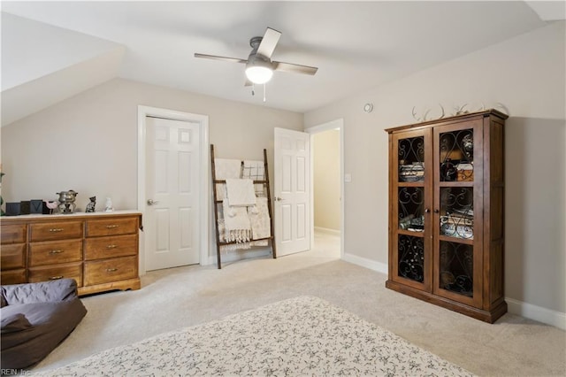 carpeted bedroom with ceiling fan and lofted ceiling