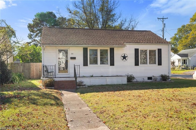 bungalow-style home featuring a front lawn