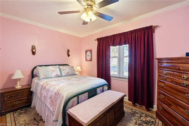 bedroom with ceiling fan and ornamental molding