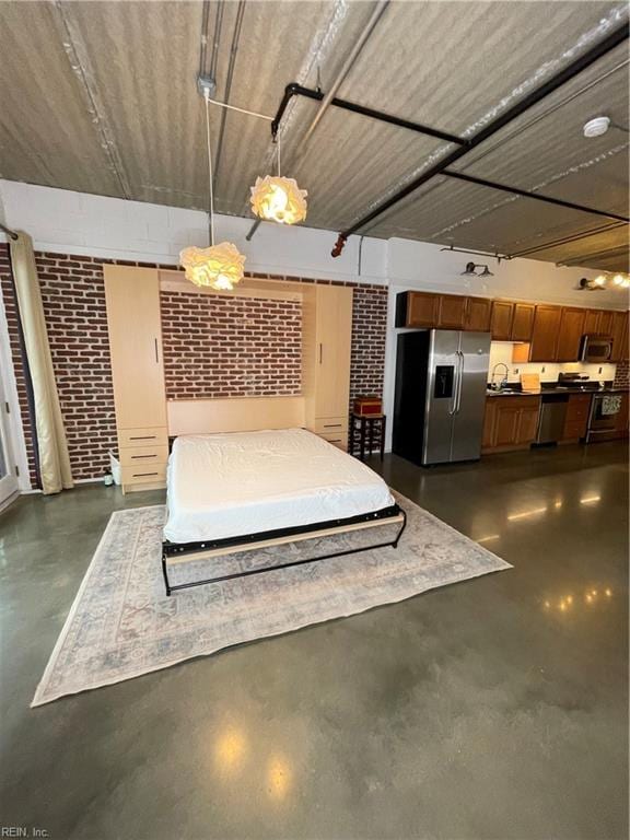 interior space with stainless steel fridge with ice dispenser and sink