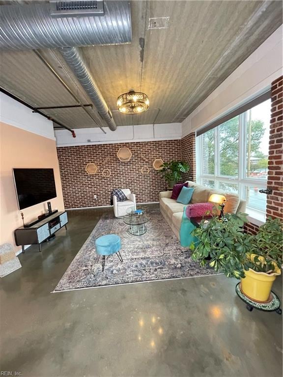 living room featuring brick wall