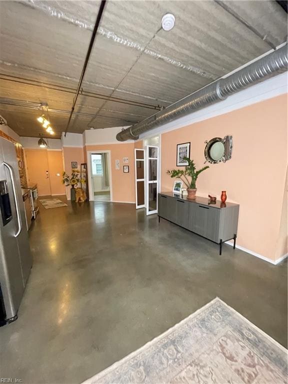 interior space featuring stainless steel fridge