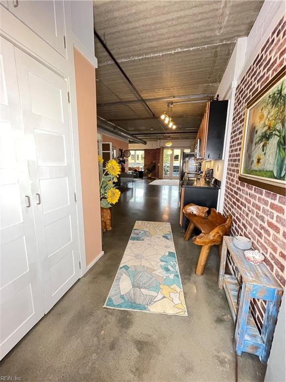 hallway with brick wall