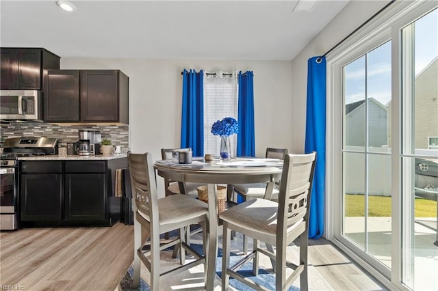 dining area with light hardwood / wood-style floors