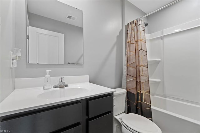 full bathroom featuring vanity, shower / bath combo, and toilet