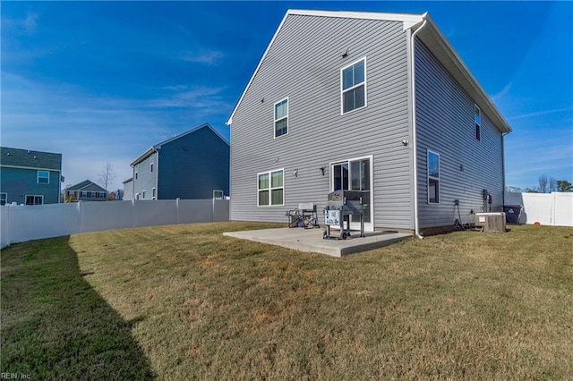 back of house with a yard, a patio, and cooling unit