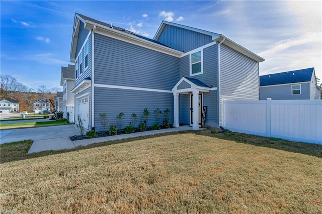 view of front property with a garage and a front lawn