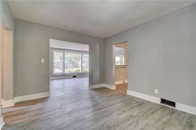 unfurnished room featuring light wood-type flooring