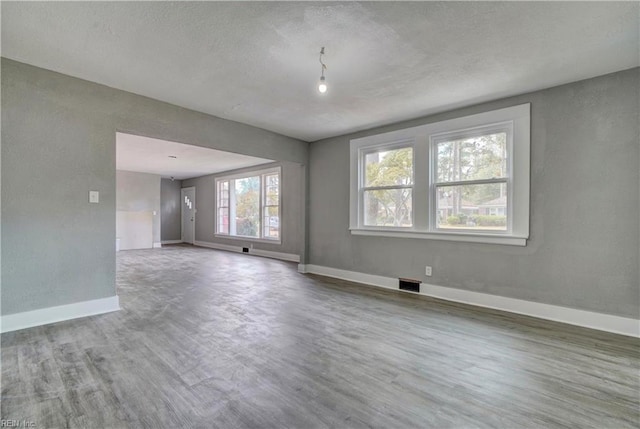 empty room featuring hardwood / wood-style floors