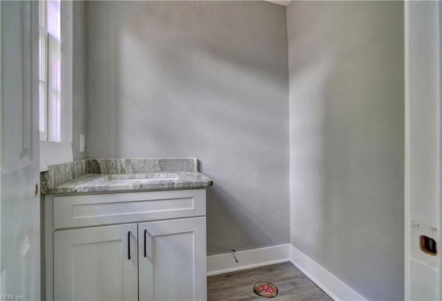 bathroom featuring vanity and hardwood / wood-style flooring