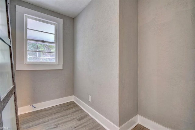 empty room with wood-type flooring