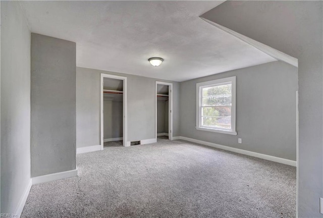 unfurnished bedroom featuring carpet flooring