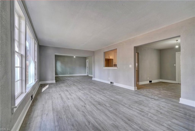 empty room featuring hardwood / wood-style floors and a textured ceiling